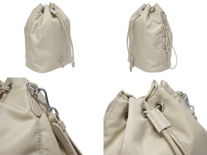 極美品 PRADA プラダ ハンドバッグ 巾着型 ロゴプレート Re