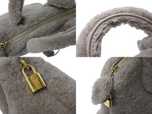 Load image into Gallery viewer, 新品同様 LOUIS VUITTON ルイヴィトン 2011AW ロックイット ヴォワヤージュ M93850 ムートン レザー グリペルル ゴールド金具 中古 4b001189