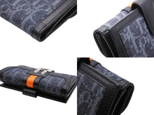 Load image into Gallery viewer, Like new Christian Dior bifold compact wallet in Trotter line, navy, black, and orange, pre-owned, item number 4b007438 