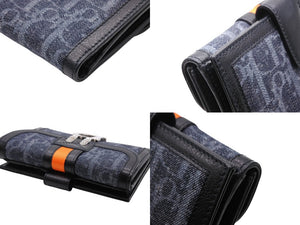 Like new Christian Dior bifold compact wallet in Trotter line, navy, black, and orange, pre-owned, item number 4b007438 