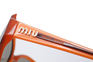 MIUMIU ミュウミュウ サングラス サイズ59□15 130 オレンジ サイドロゴ プラスチック SMU19G 小物 美品 中古 66730