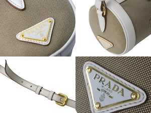 PRADA プラダ ドラム型ショルダ－バッグ キャンバス レザー リボン ベージュ ホワイト ゴールド金具 美品 中古 56933